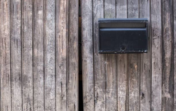 istock Iron Mailbox on Wooden Door 1007632948