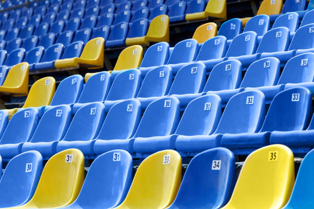 istock Yellow and blue plastic seats in the stadium 1007639768