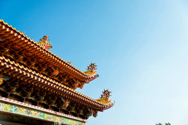 istock Chinese style temple roof under blue sky 1007645752