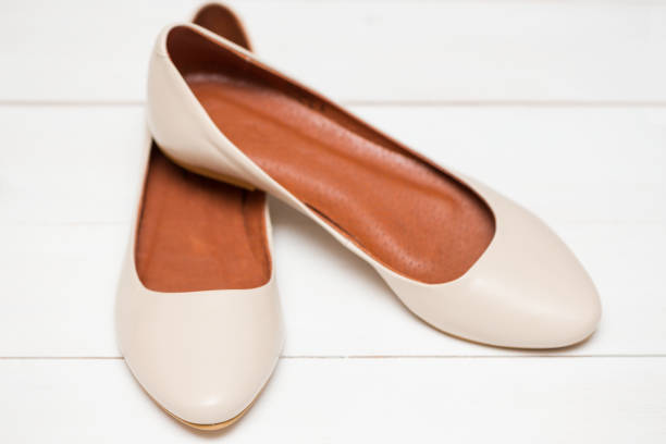 istock beige shoes on a white background 1007652178