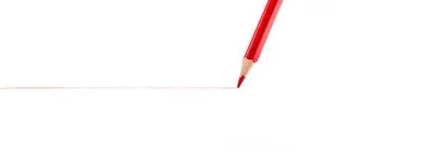 Photo of the red pencil on a white background