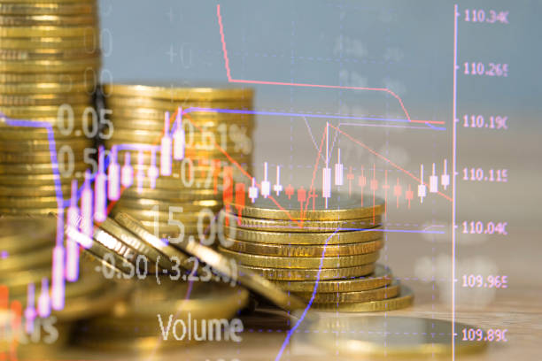 istock Double exposure of coin stack with stock market screen chart board and candle stick for financial business and investor analysis concept. 1007656178
