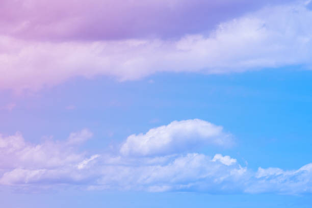 istock Sweet pastel colored cloud and sky with sun light, soft cloudy with gradient pastel color background. 1007658410