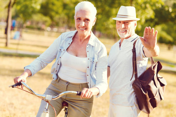istock Charming senior couple spending active day in local park 1007659054