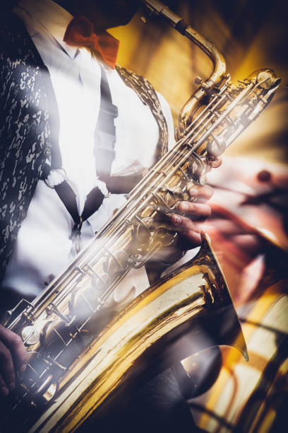 istock The saxophonist expressively plays the gold saxophone 1007661680