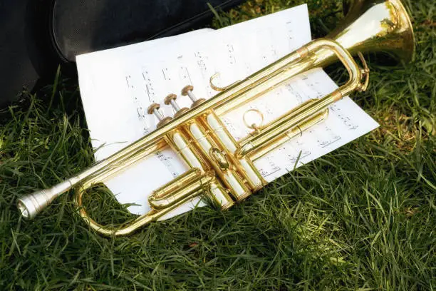 Photo of A musical trumpet with paper notes