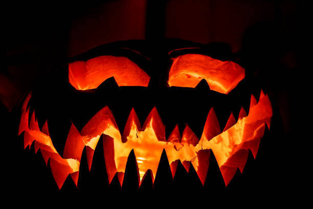 istock Spooky glowing Halloween pumpkin face 1007665342