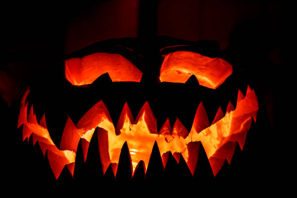istock Spooky glowing Halloween pumpkin face 1007665346