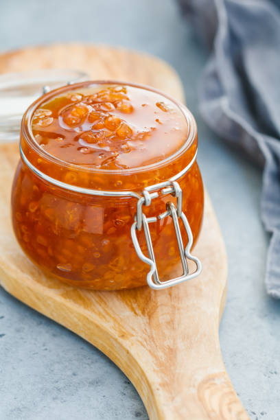 istock Glass jar with cloudberry jam. Nordic cuisine. 1007665546