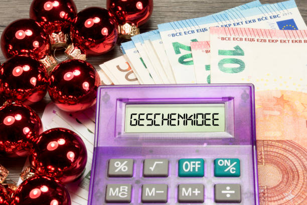 Christmas baubles, Euro banknotes, calculators and gift idea Christmas balls, Euro banknotes, calculator and gift idea euro bill in a christmas ornament stock pictures, royalty-free photos & images