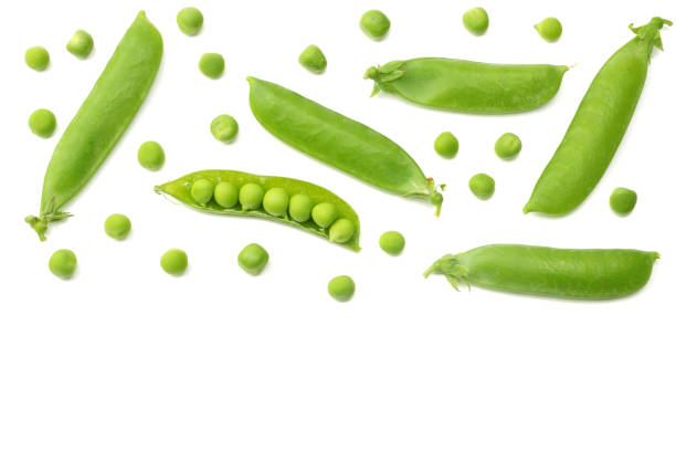 istock fresh green peas isolated on a white background. top view 1007668524