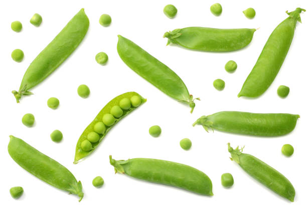 istock fresh green peas isolated on a white background. top view 1007668526