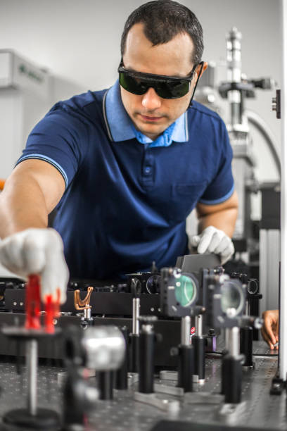 istock Adult Researcher Adjusting Powerful High Frequency Laser 1007669014