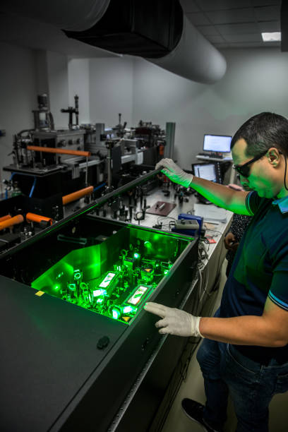istock Group of Researchers Using Powerful High Frequency Laser 1007669046