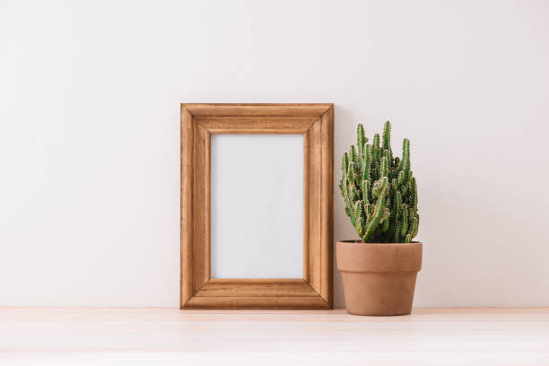 istock mock up frame with cactus pot on wooden floor 1007675486