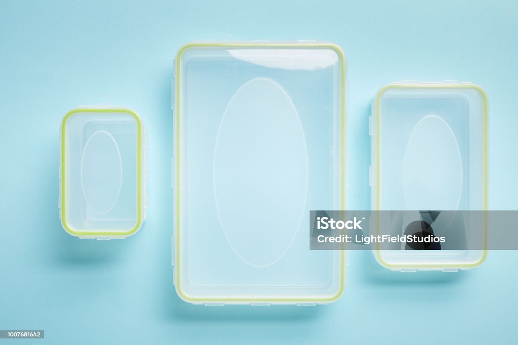 top view of empty food containers isolated on blue Empty Stock Photo
