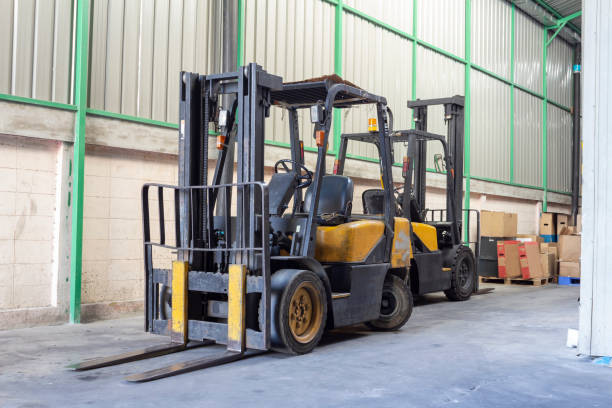 istock The forklift is old and scratched in warehouse. Yellow color. 1007681800