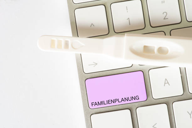 istock A computer, pregnancy test and the button for family planning 1007681856