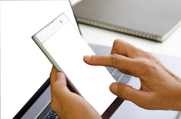istock Hand of the man using the mobile phone with notebook, business concept 1007684682