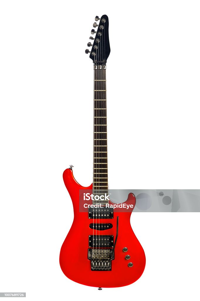 Hard rock guitar in red Extreme rock guitar in bright red, with whammy bar and three pickups. Electric Guitar Stock Photo