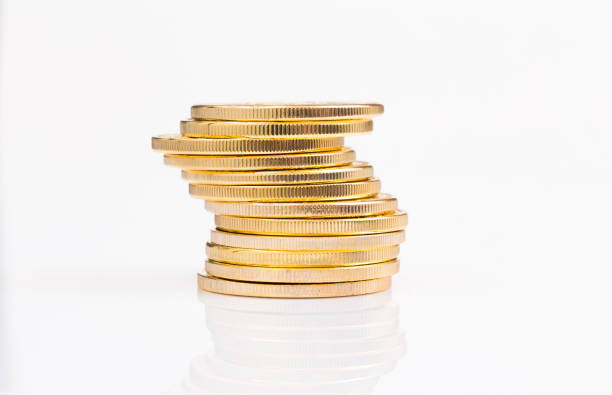 istock Stack of golden coins on white background 1007689796