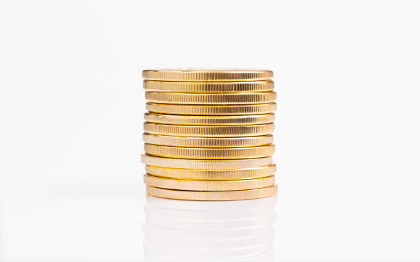 istock Stack of golden coins on white background 1007694016