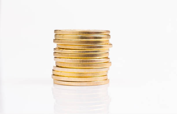 istock Stack of golden coins on white background 1007694500