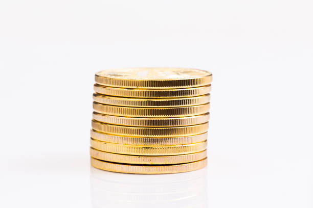 istock Stack of golden coins on white background 1007698714