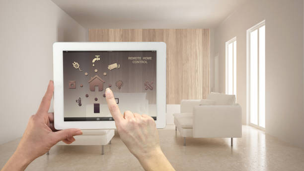 istock Smart remote home control system on a digital tablet. Device with app icons. Minimalist modern bright living room in the background, architecture interior design 1007705430