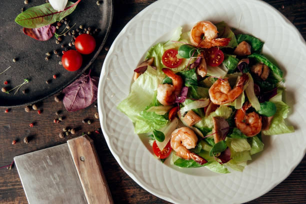 istock vegetable salad with shrimps composition dark wood background 1007705578