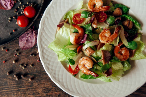 istock vegetable salad with shrimps composition dark wood background 1007705602