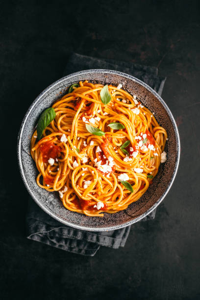 istock Italian pasta with tomato sauce in bowl 1007705750