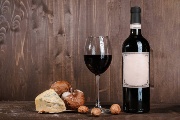 istock red wine composition with bread, two bottles in box and wineglass on wooden background 1007706172