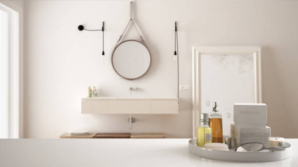 istock Spa, hotel bathroom concept. White table top or shelf with bathing accessories, toiletries, over blurred luxury bathroom, modern architecture interior design 1007706230