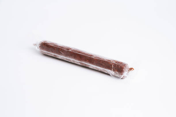 istock Smoked sausage in transparent plastic package 1007709376