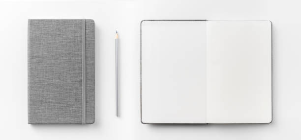 istock Top view collection of  grey notebook front, back pen, and white open page isolated on background for mockup 1007710182