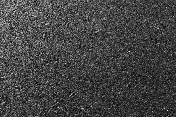 istock close up of asphalt road texture 1007710438