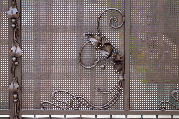 istock ornate wrought-iron elements of metal gate decoration 1007710582