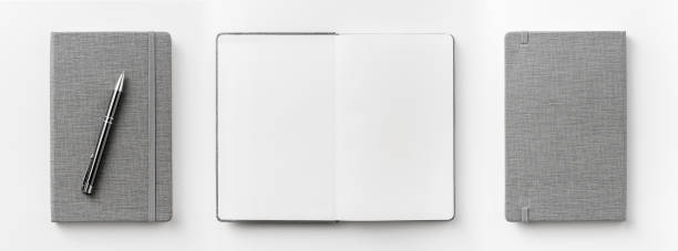 istock Top view collection of  grey notebook front, back pen, and white open page isolated on background for mockup 1007712898