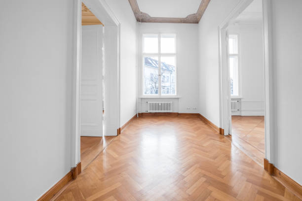 istock renovated old building room, flat with stucco ceiling and parquet floor 1007713124