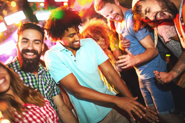 istock Friends dancing at a concert. 1007713770