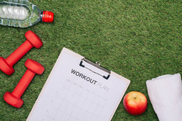 istock sports equipment on green grass background 1007714036