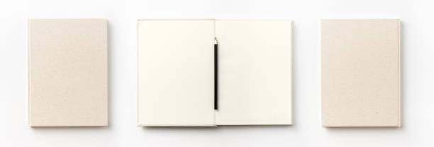 istock Top view collection of  light yellow fabric notebook front, back , pen and white open page isolated on background for mockup 1007716356