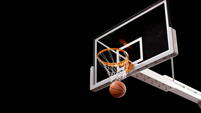 Beautiful Professional Long Throw in a Basketball Hoop Slow Motion. Ball Flies Spinning into Basket Net on Black Background and Green Screen. Sport Concept. 3d Animation Alpha Matte 4k UHD 3840x2160.