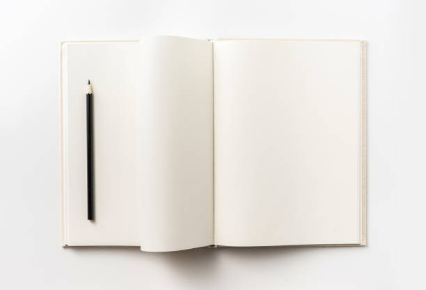 istock Top view collection of  light yellow fabric notebook , pen, flip curl rolled page and white open page isolated on background for mockup 1007716796