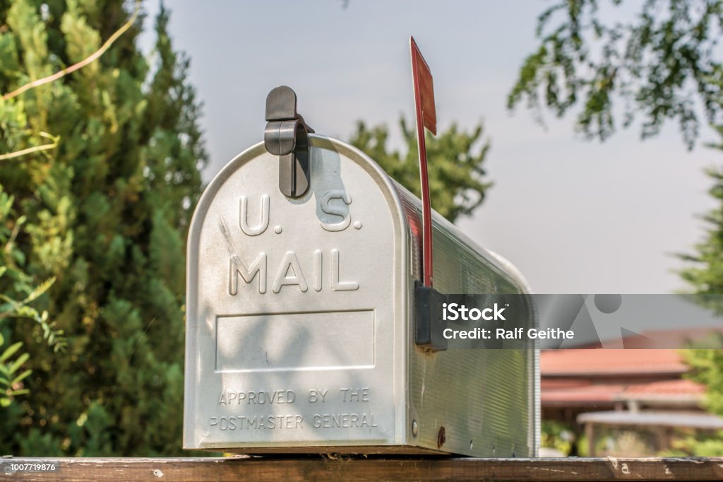 US mailbox from the front with upright flag US Mail Mailbox Mailbox Stock Photo