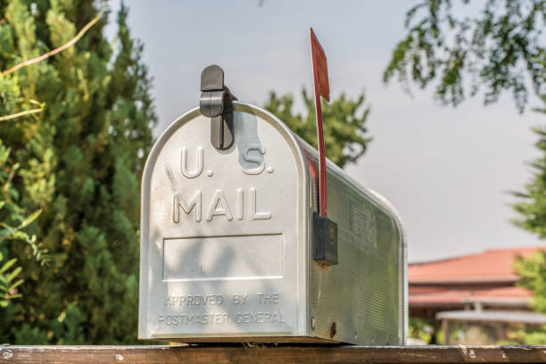 US mailbox from the front with upright flag US Mail Mailbox united states postal service photos stock pictures, royalty-free photos & images