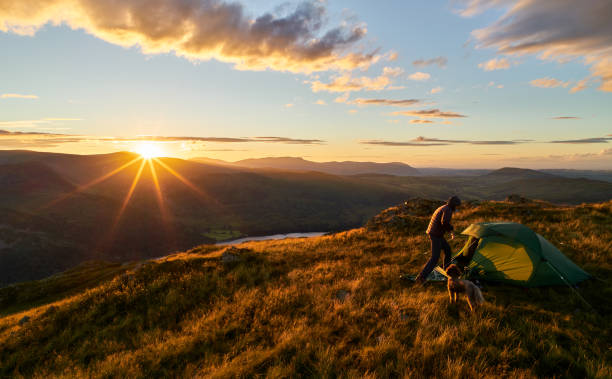 istock A hiker camping on the mountain summit of Place Fell. 1007726326