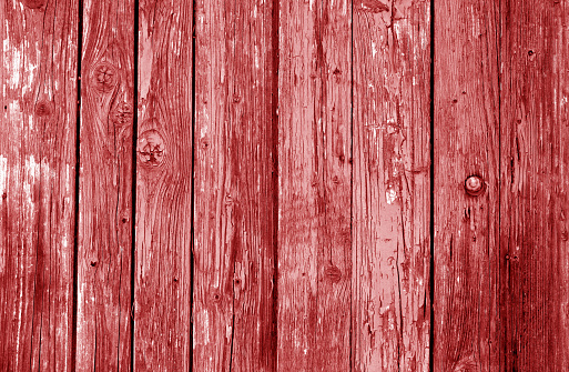 Old grunge wooden fence pattern in red tone. Abstract background and texture for design.