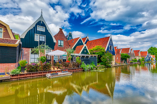 A traditional Dutch village with colorful, old wooden houses and canals